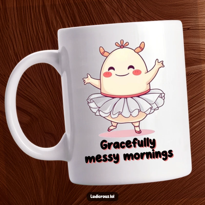 Funny mug showing a cheerful, round blob monster in a pink tutu, awkwardly trying a ballet pose with determination and a huge smile.