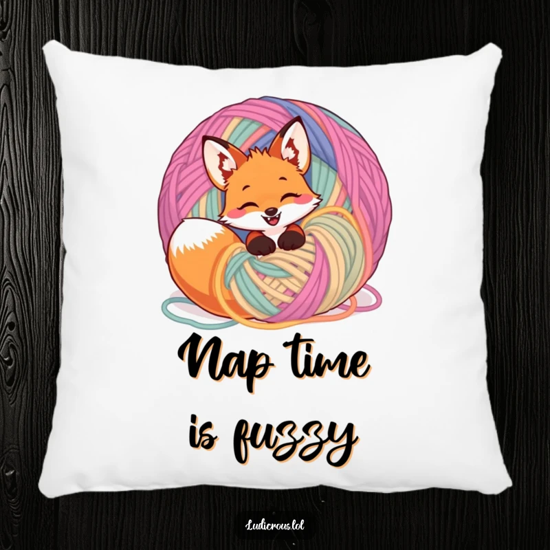 Funny giggling fox tangled in a ball of yarn, designed on a pillow for comfortable, humorous, and playful decor.