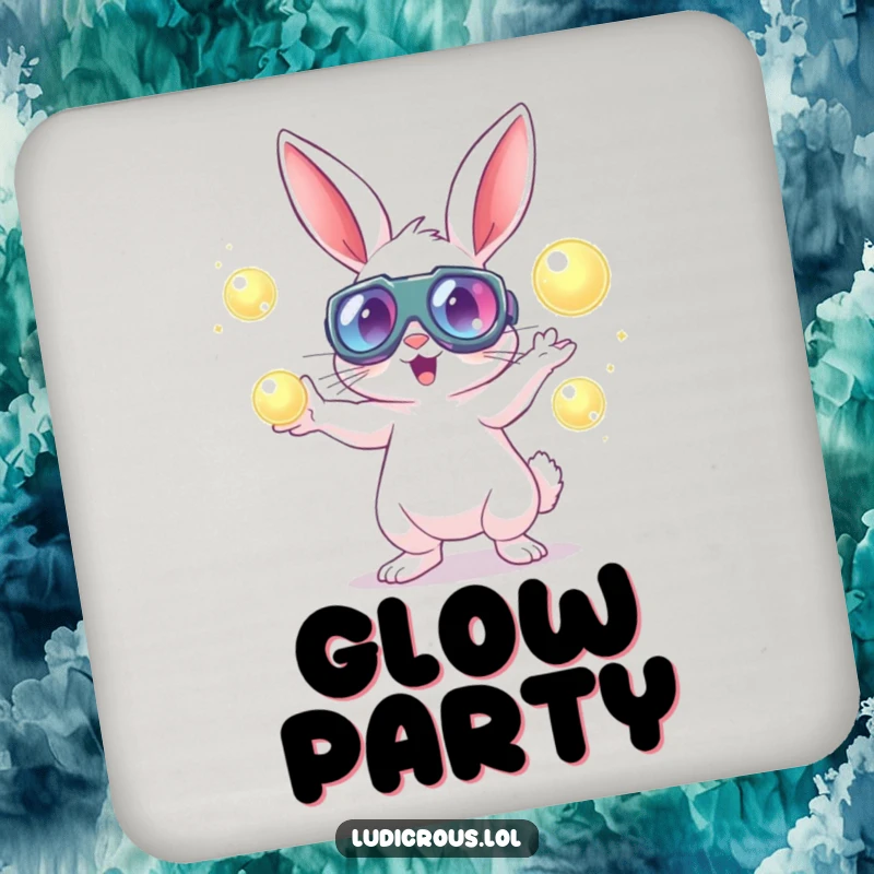 A rabbit wearing goggles energetically juggles glowing orbs on a drink coaster, a humorous addition to any table.