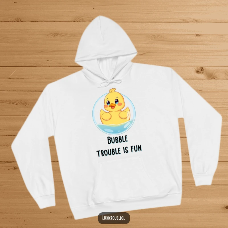 Funny hoodie featuring a happy rubber ducky floating on a giant bubble with eyes wide with glee, ideal for cozy fun.