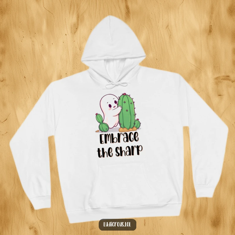 Funny ghost attempting a hug with a spiky cactus, illustrating a comical and potentially painful interaction, ideal for a cozy hoodie.