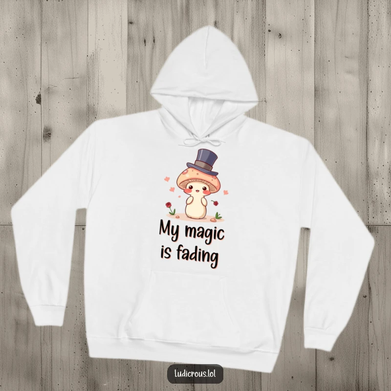 Funny hoodie featuring a blushing mushroom in a top hat, attempting to disappear, a warm and mystical garment for cozy moments.