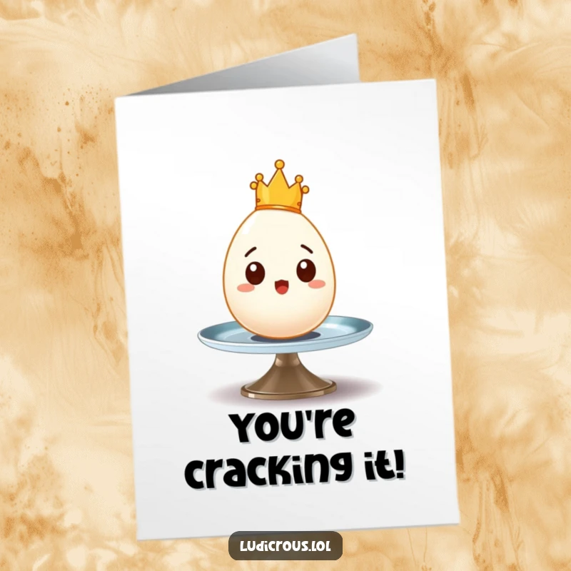 Funny Free Printable Congratulations Card: A surprised egg wearing a tiny crown wobbles on a spinning plate, celebrating a wobbly win.