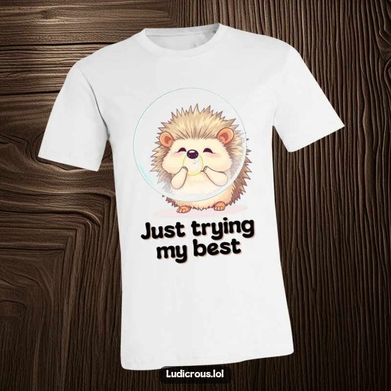 Funny hedgehog t-shirt displaying a fluffy creature comically attempting to inflate a bubble far too large for its own body, showcasing effort and humor.