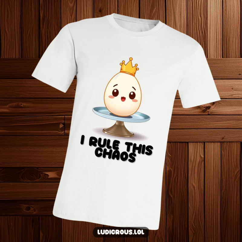 Funny t-shirt with a surprised egg wearing a tiny crown, wobbling precariously on a spinning plate, perfect for breakfast lovers.
