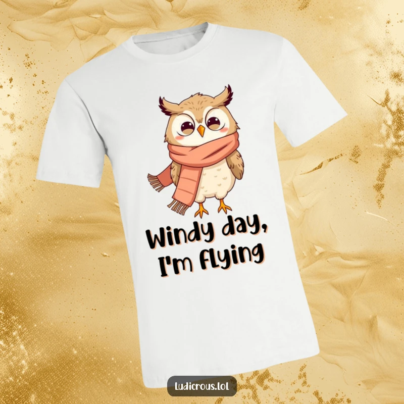 Funny t-shirt showcasing a grinning owl wearing a huge scarf, dramatically swept away by the wind.