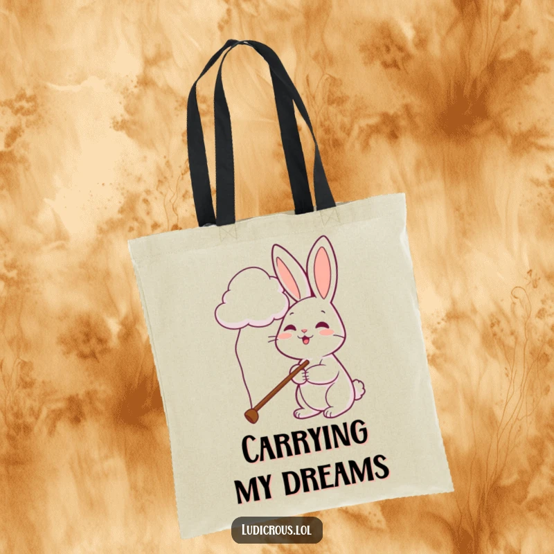 Funny rabbit tote bag shows a cheerful bunny using a comically long pole in an attempt to pet a cloud.