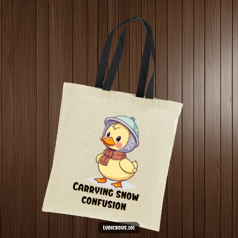 Funny tote bag showcasing a duck wearing a colander as a helmet, humorously catching falling snowflakes, ideal for grocery shopping.