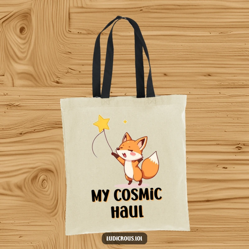 A gleeful fox enthusiastically lassoes a shooting star with a rope on a durable and funny tote bag.